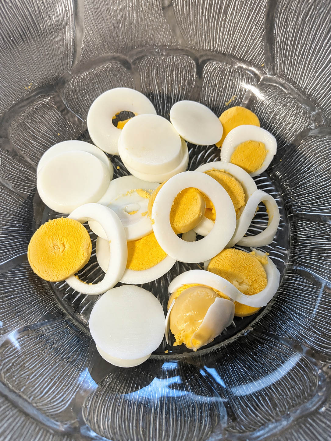 Sliced boiled egg and vinaigrette for tuna egg and potato salad